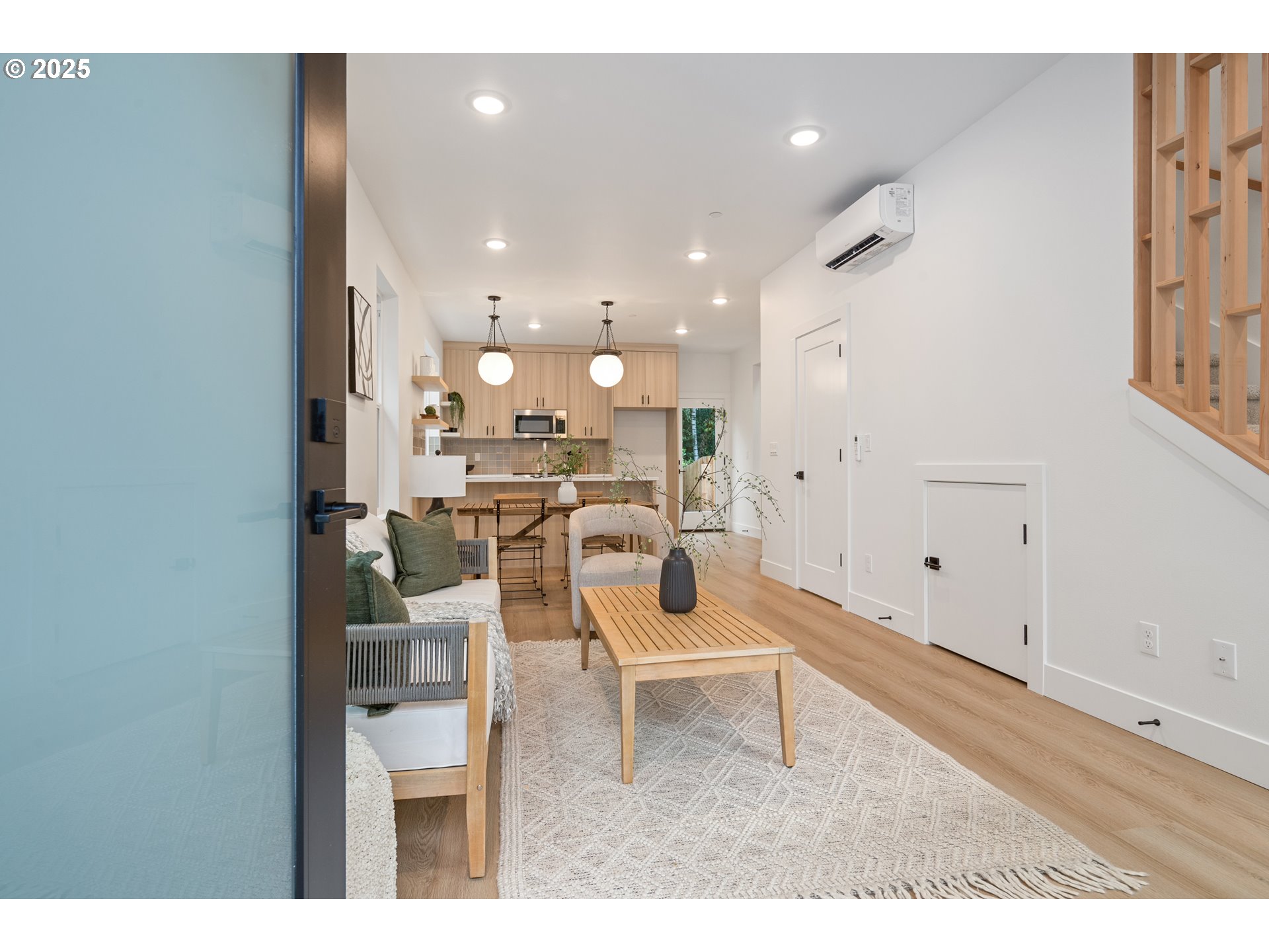 4031 Southeast Tibbetts Street Portland, OR 97202 - Photo 20 of 21 a living room with kitchen island furniture and a view of kitchen