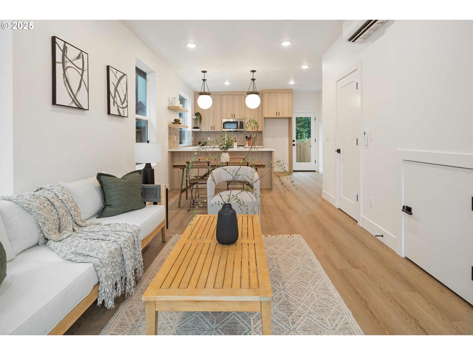 4031 Southeast Tibbetts Street Portland, OR 97202 - Photo 2 of 21 a living room with furniture and a wooden floor