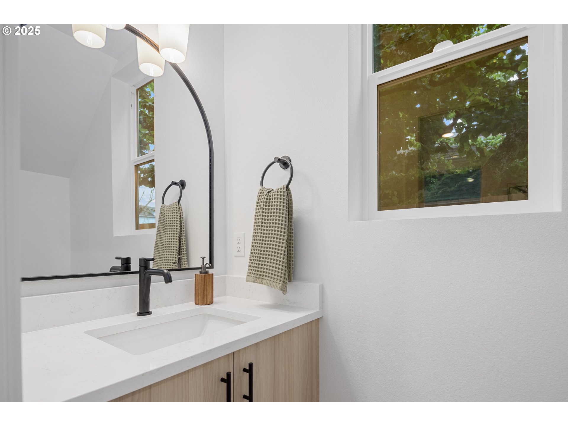 4031 Southeast Tibbetts Street Portland, OR 97202 - Photo 10 of 21 a bathroom with a sink and mirror