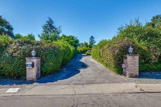 235 Crest Road Woodside, CA 94062 - Photo 1 of 1 front view of a house with a yard and a street