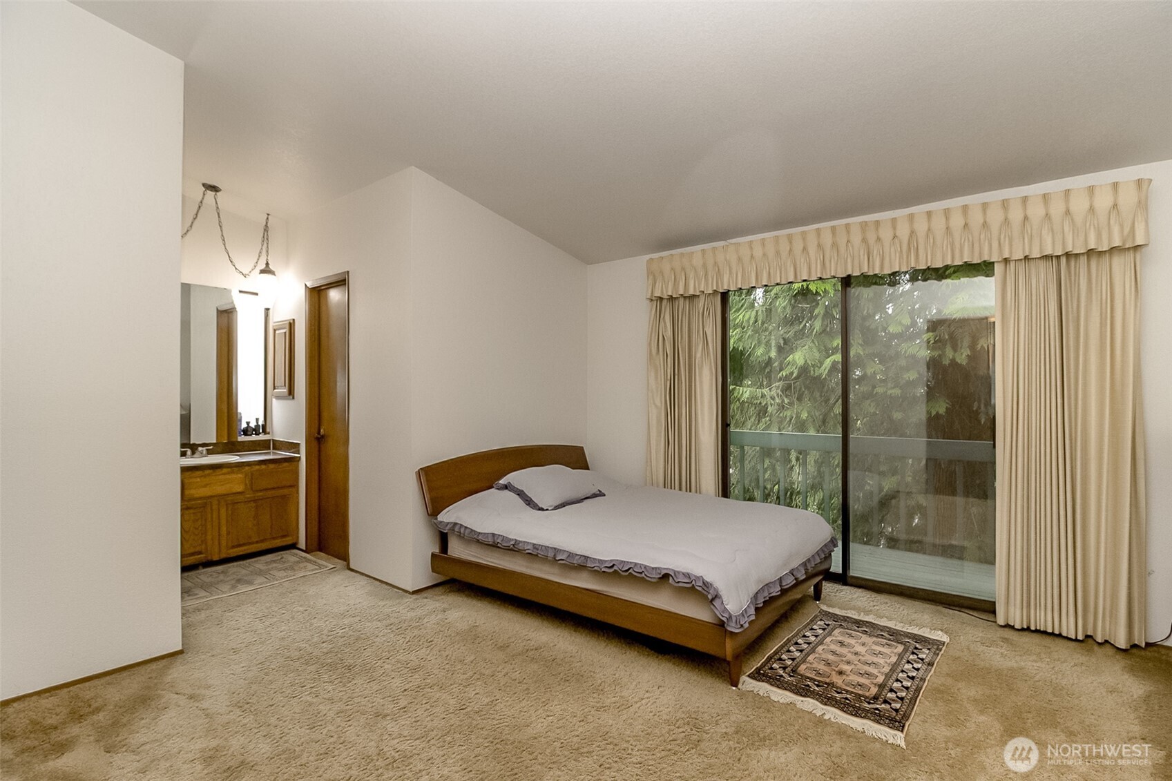 22121 4th Avenue Southeast Bothell, WA 98021 - Photo 11 of 22 a bedroom with a bed and large window