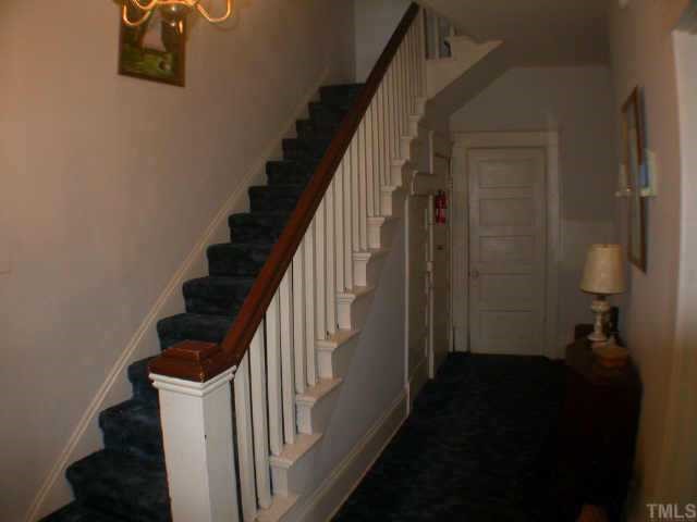 509 East Franklin Street Raleigh, NC 27604 - Photo 4 of 10 The entrance and old fashioned staircase. There are hardwood floors under the carpet!