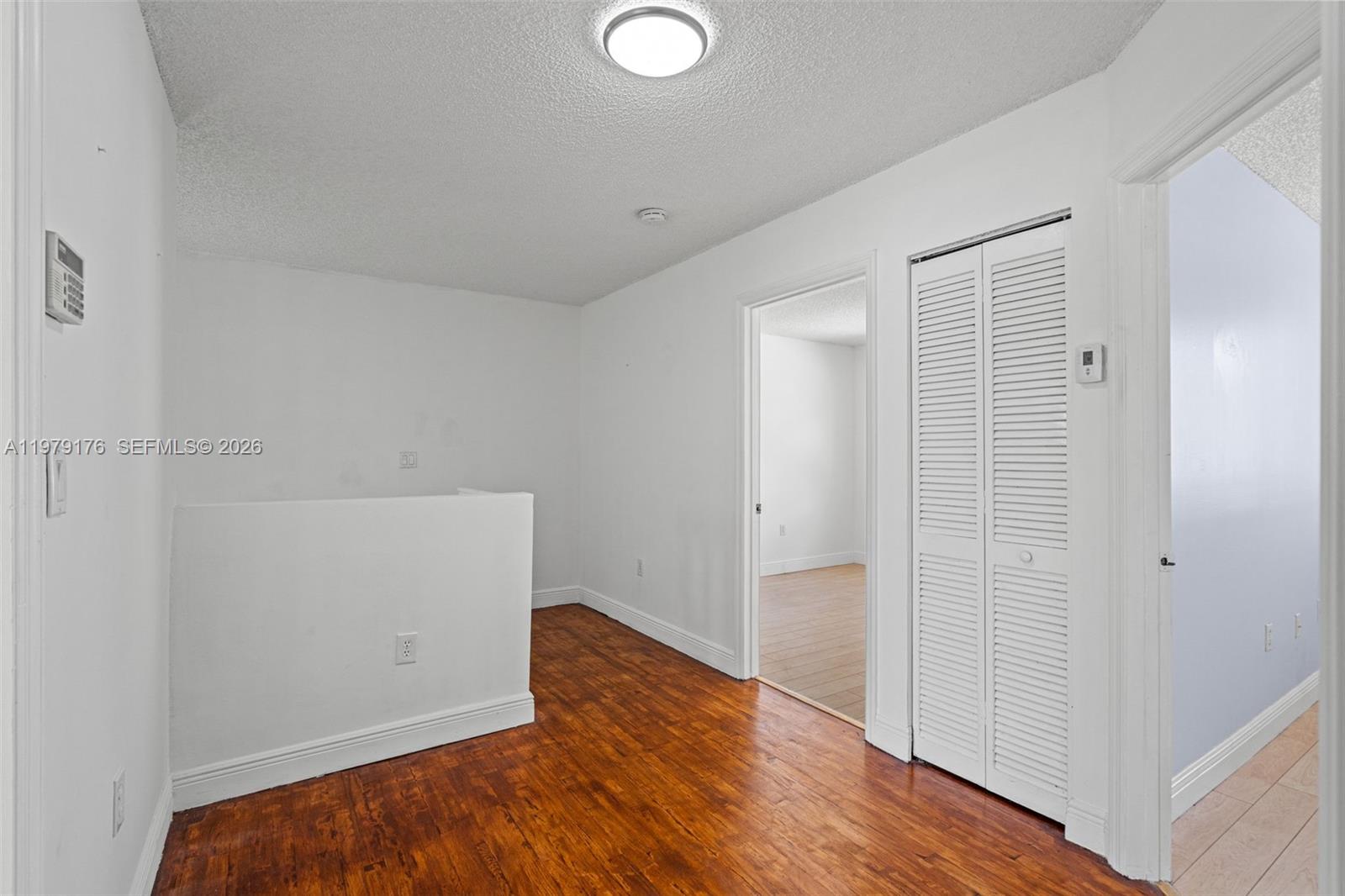 7413 Southwest 162nd Path Miami, FL 33193 - Photo 23 of 44 wooden floor in an empty room