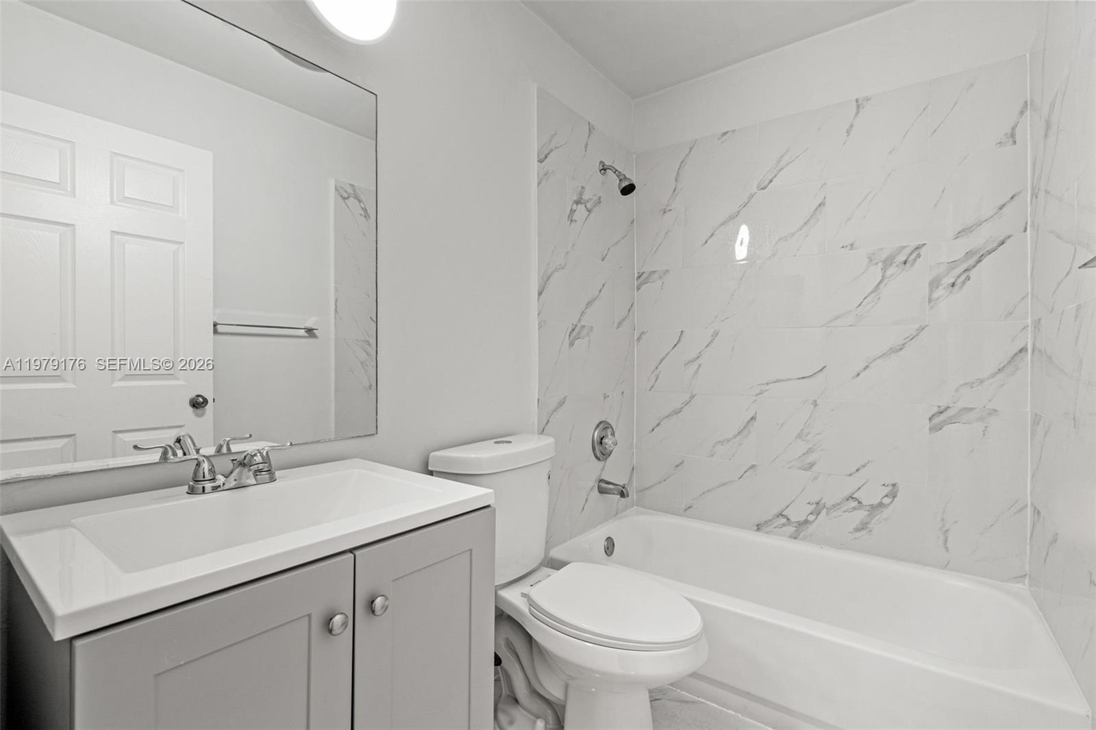 7413 Southwest 162nd Path Miami, FL 33193 - Photo 26 of 44 a bathroom with a sink toilet and bathtub