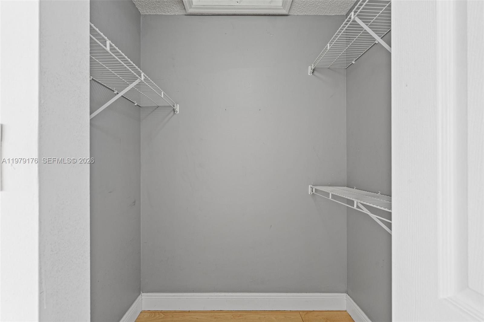 7413 Southwest 162nd Path Miami, FL 33193 - Photo 33 of 44 a view of a room with racks on the wall