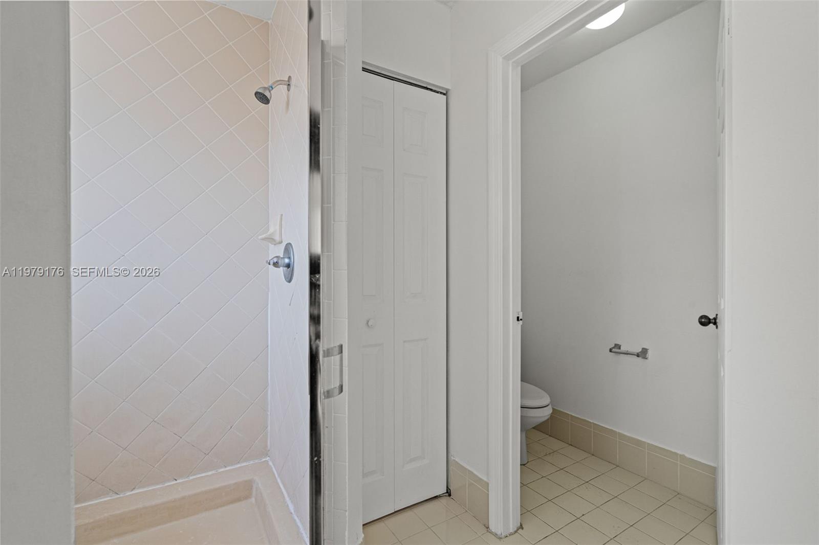 7413 Southwest 162nd Path Miami, FL 33193 - Photo 35 of 44 a room that has a mirror in it