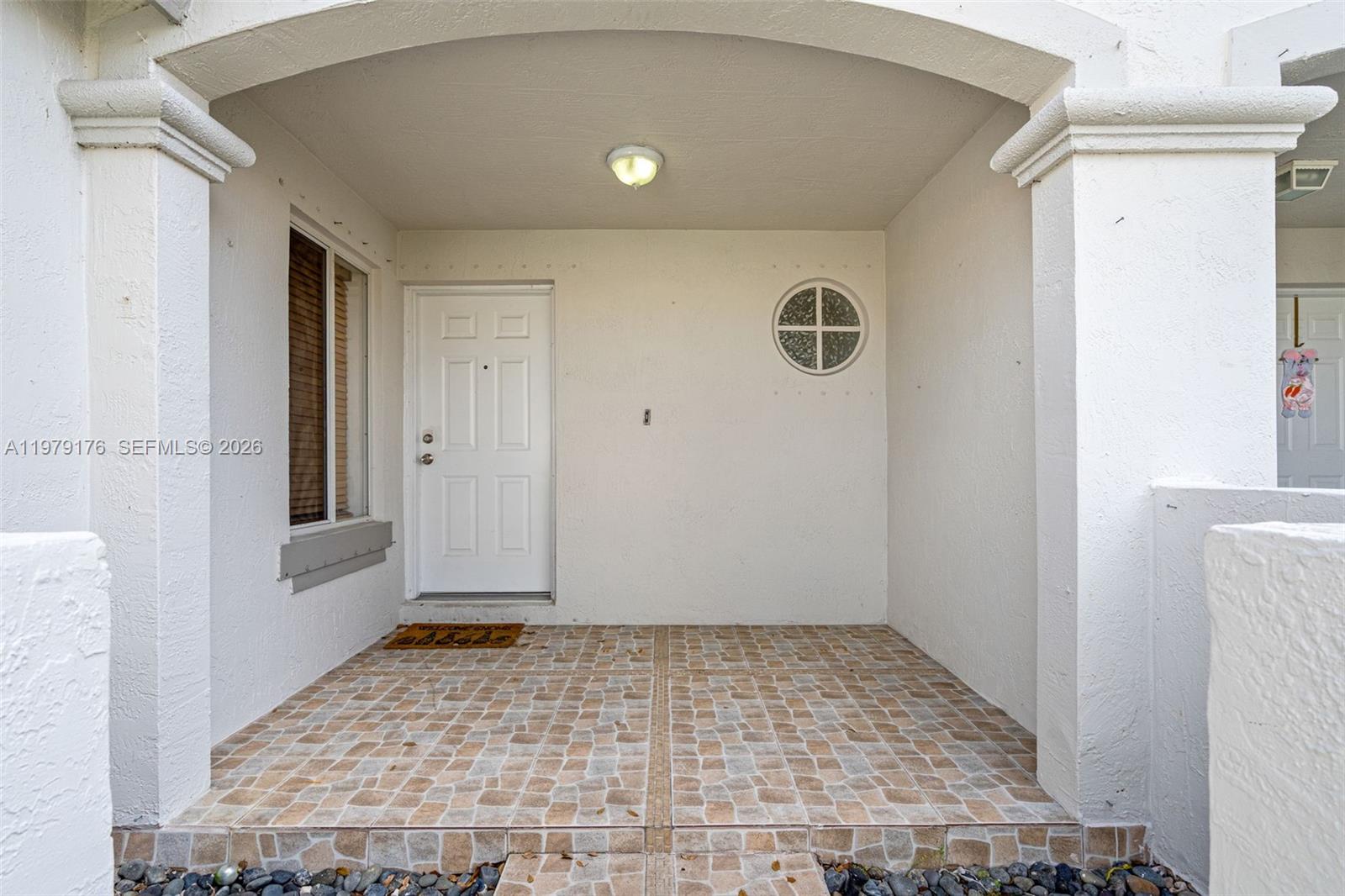 7413 Southwest 162nd Path Miami, FL 33193 - Photo 5 of 44 a view of a door