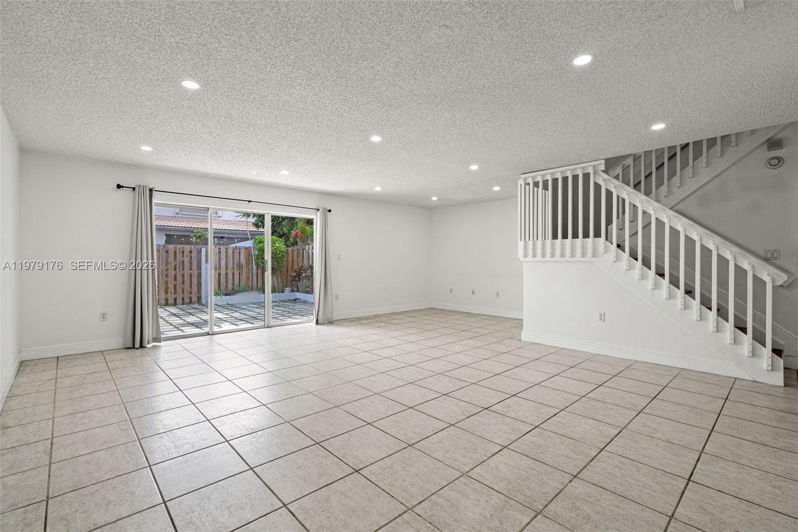 7413 Southwest 162nd Path Miami, FL 33193 - Photo 10 of 44 a view of an empty room and window
