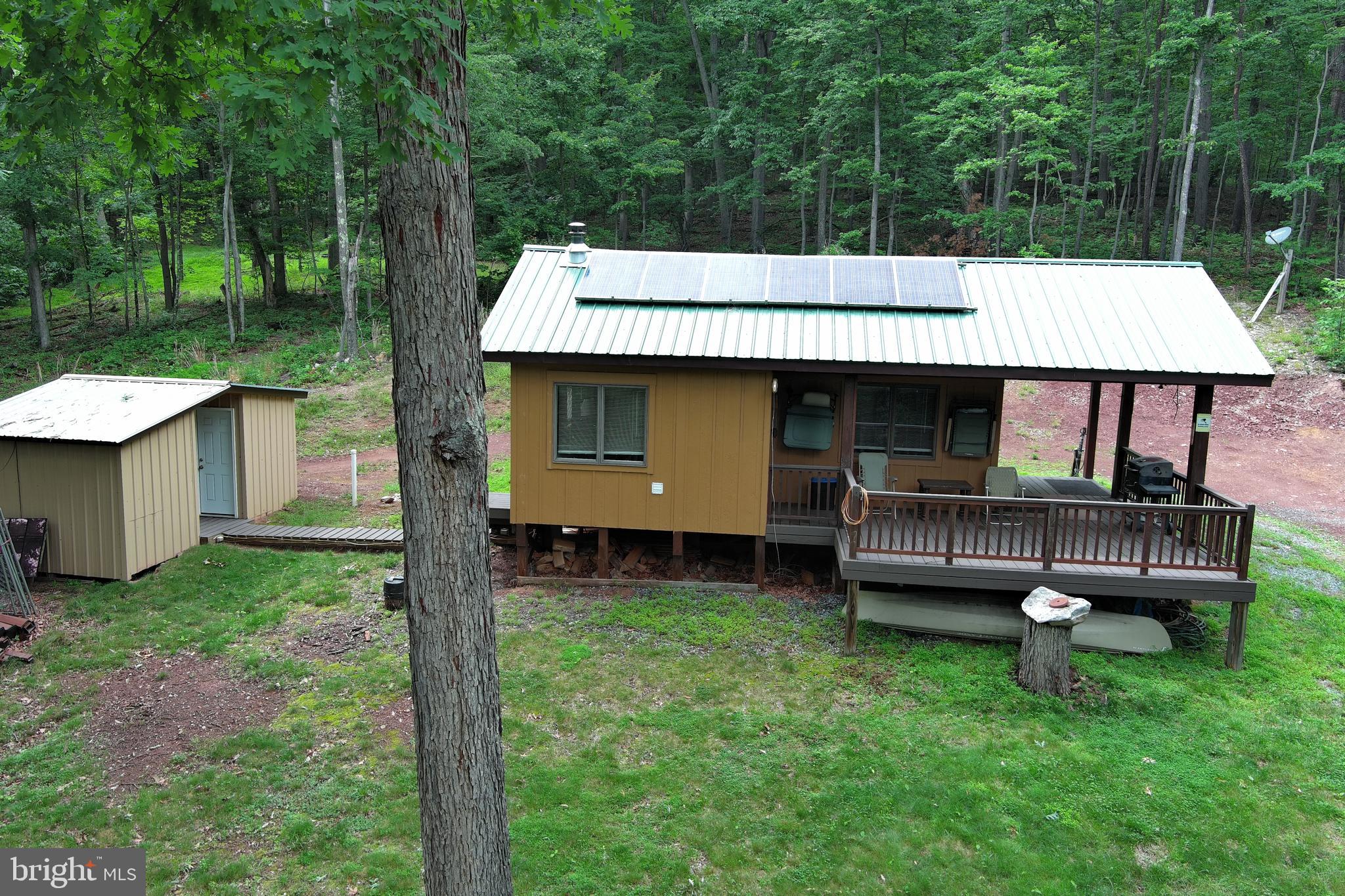 1419 Paul's Woods Road Delray, WV 26714 - Photo 100 of 105 a view of a backyard with a tub and trees in the back yard