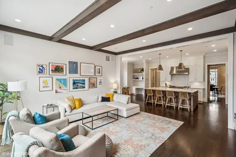 a lobby with furniture and a fireplace