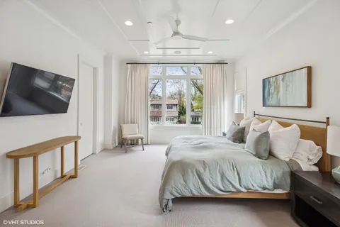 a bedroom with a bed and a television