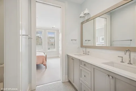 a spacious bedroom with a bed and a large window