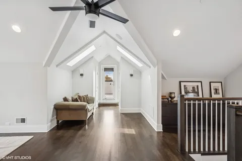 a work room with furniture and wooden floor