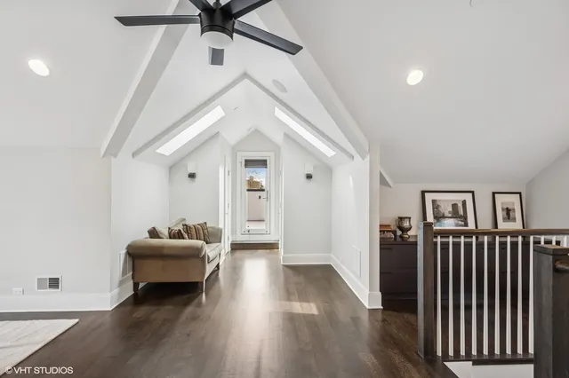 a work room with furniture and wooden floor