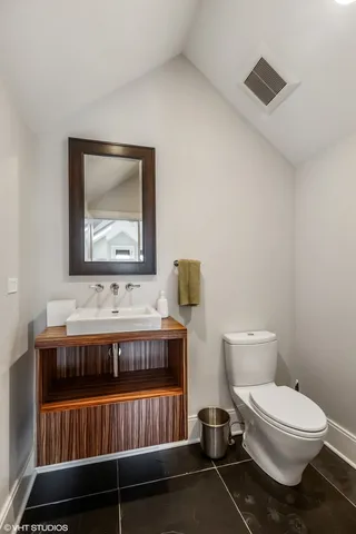 a view of house with outdoor space and wooden floor
