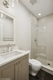 a kitchen with a sink and a refrigerator