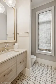 a kitchen with stainless steel appliances granite countertop a sink and a wooden floors