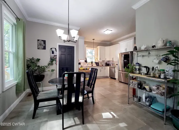 a view of a dining room kitchen and a window