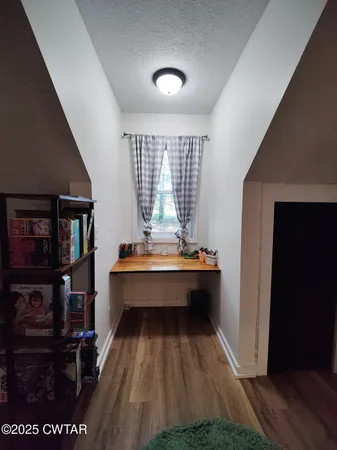 a room with pool table and a rug