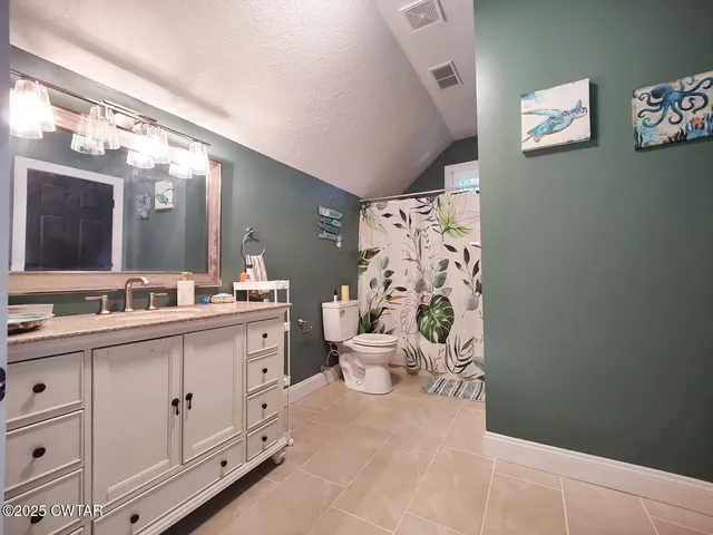 a spacious bathroom with a double vanity sink mirror and