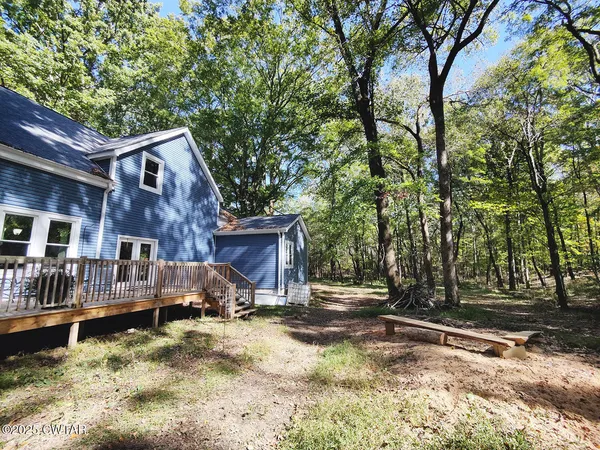 a view of house with yard