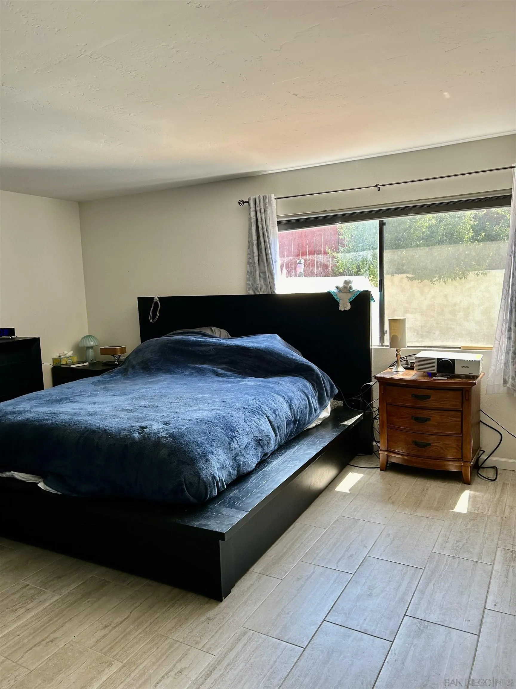 9627 Ramsgate Way Santee, CA 92071 - Photo 11 of 21 a bedroom with a bed and window
