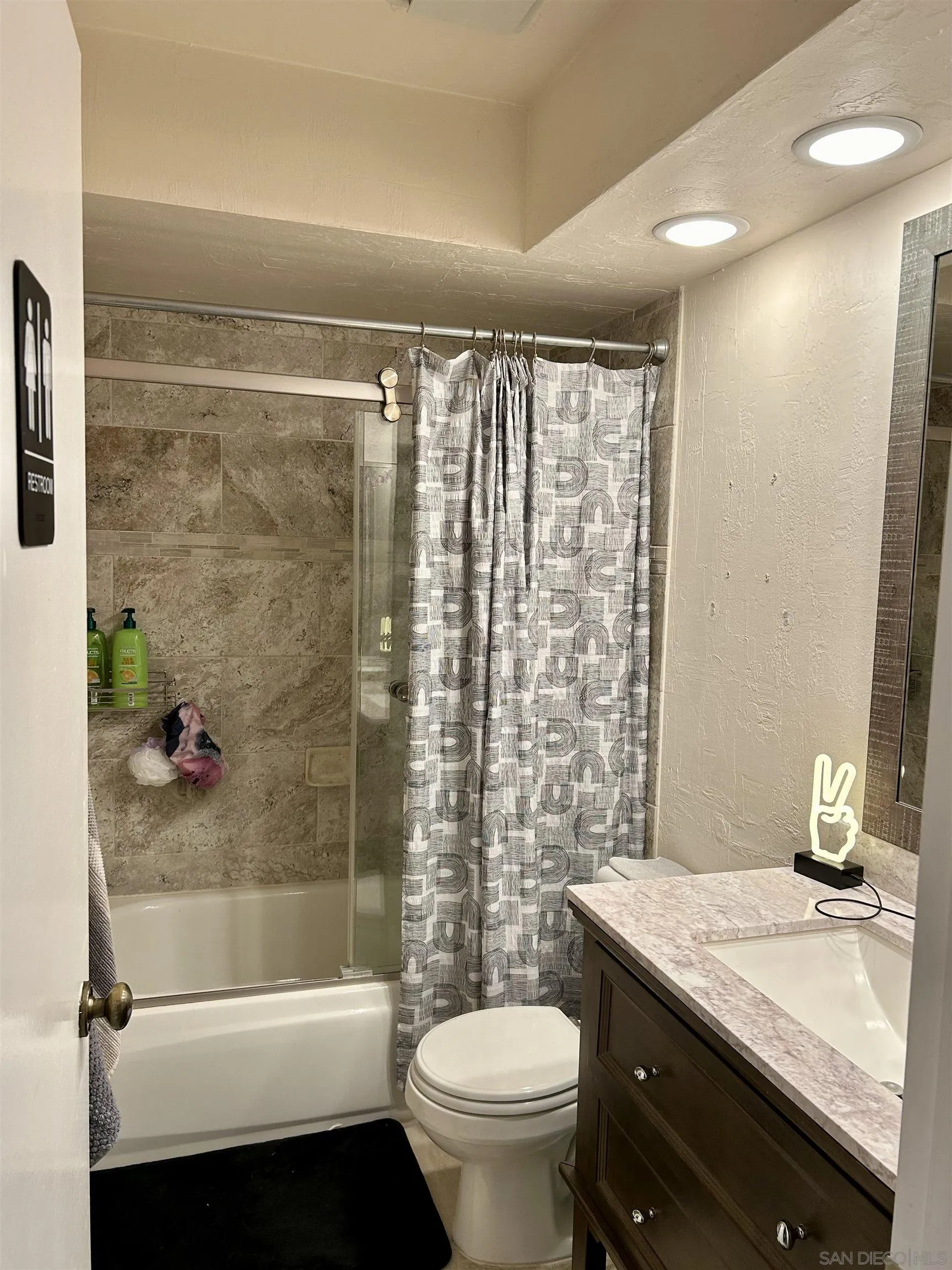 9627 Ramsgate Way Santee, CA 92071 - Photo 14 of 21 a bathroom with a granite countertop sink toilet and shower