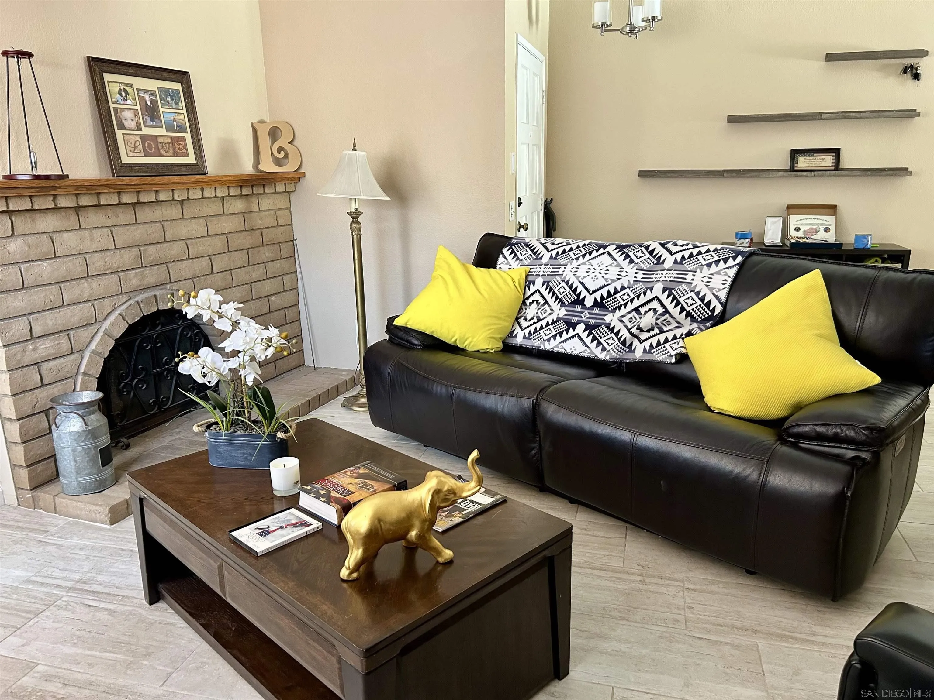 9627 Ramsgate Way Santee, CA 92071 - Photo 15 of 21 a living room with furniture and a fireplace