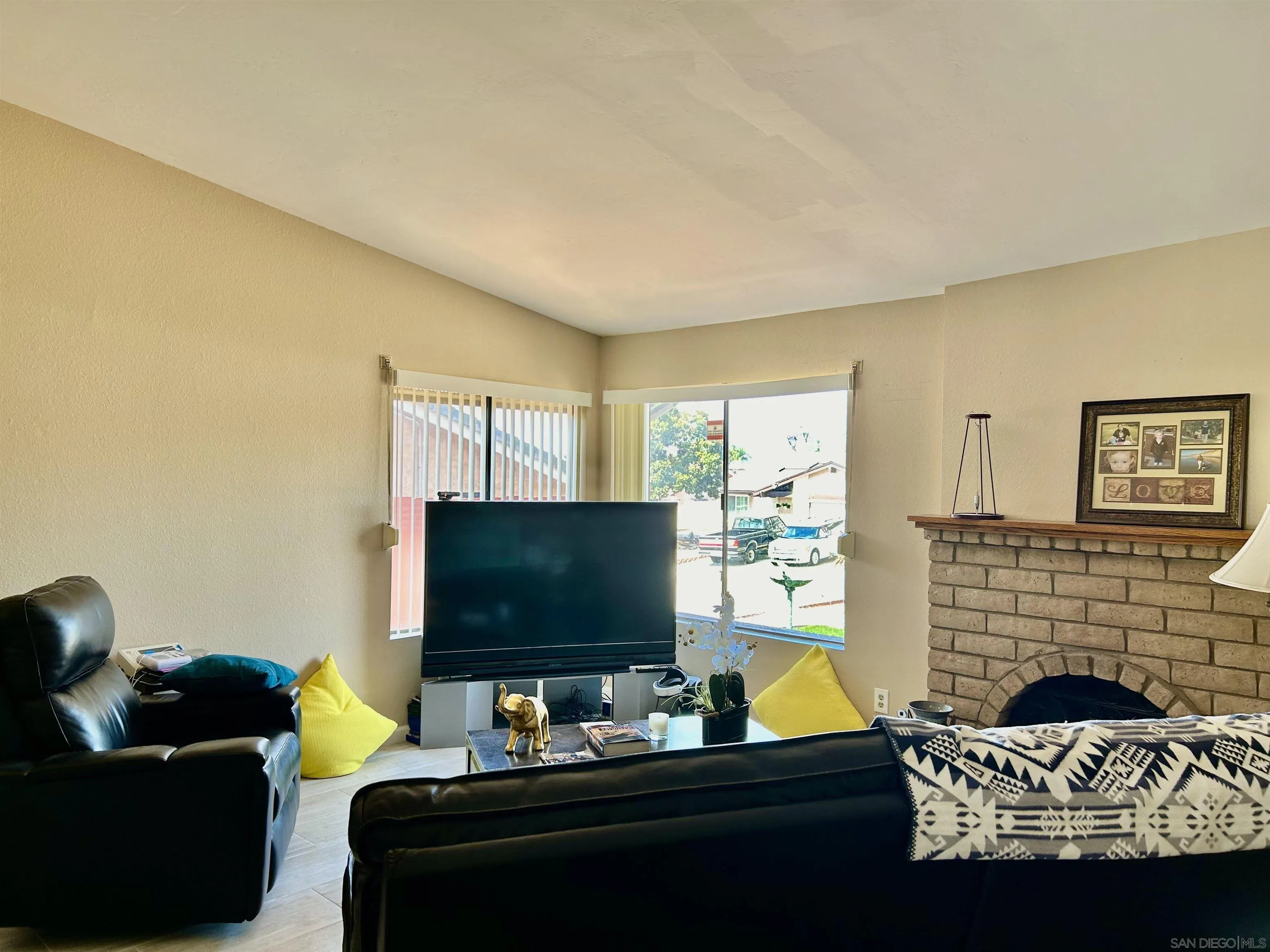 9627 Ramsgate Way Santee, CA 92071 - Photo 16 of 21 a living room with furniture and a flat screen tv