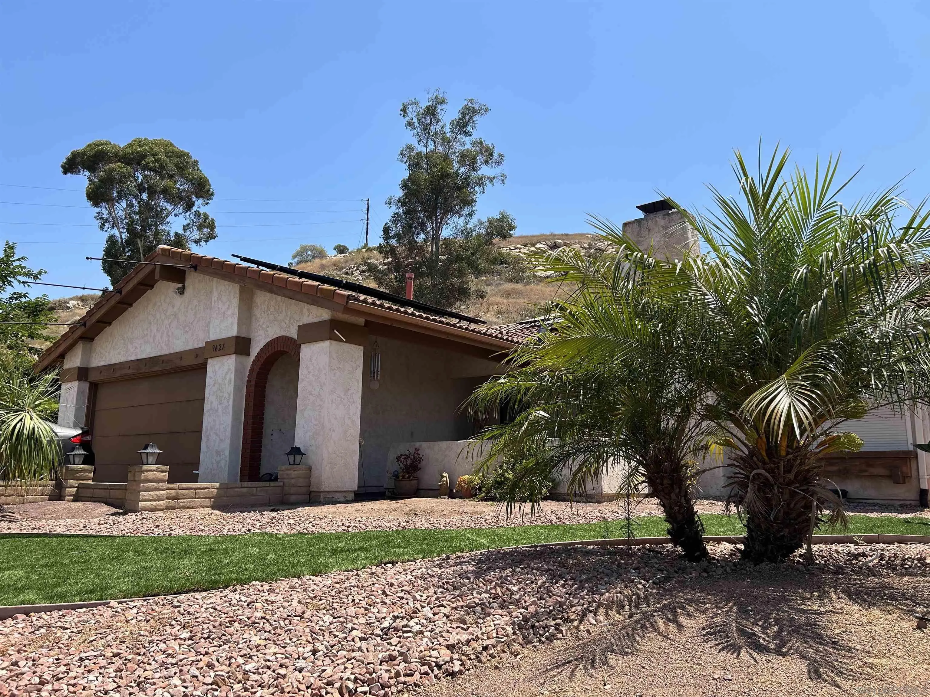 9627 Ramsgate Way Santee, CA 92071 - Photo 17 of 21 a view of a house with a yard and plants