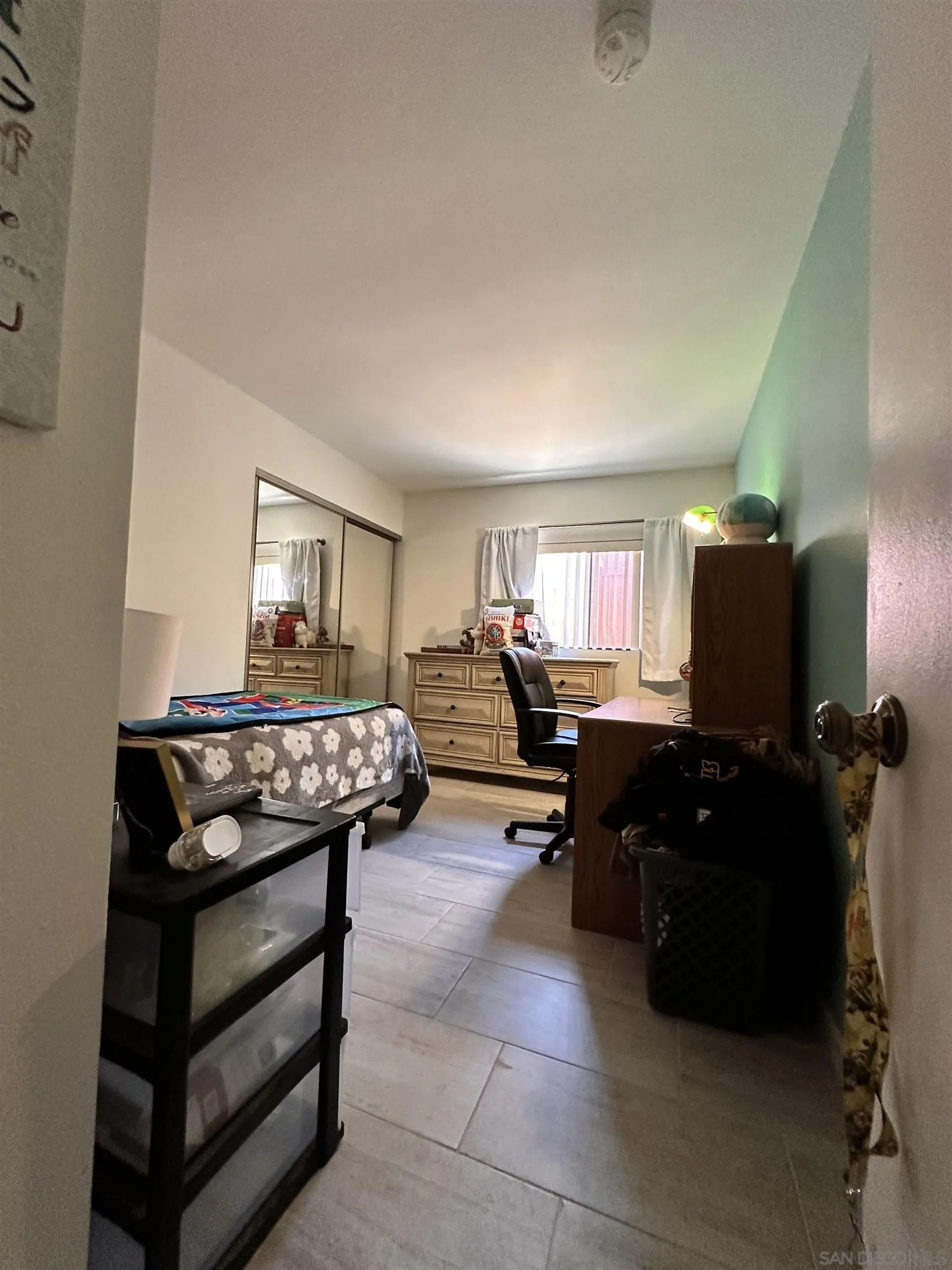 9627 Ramsgate Way Santee, CA 92071 - Photo 3 of 21 a living room with furniture a flat screen tv and dresser
