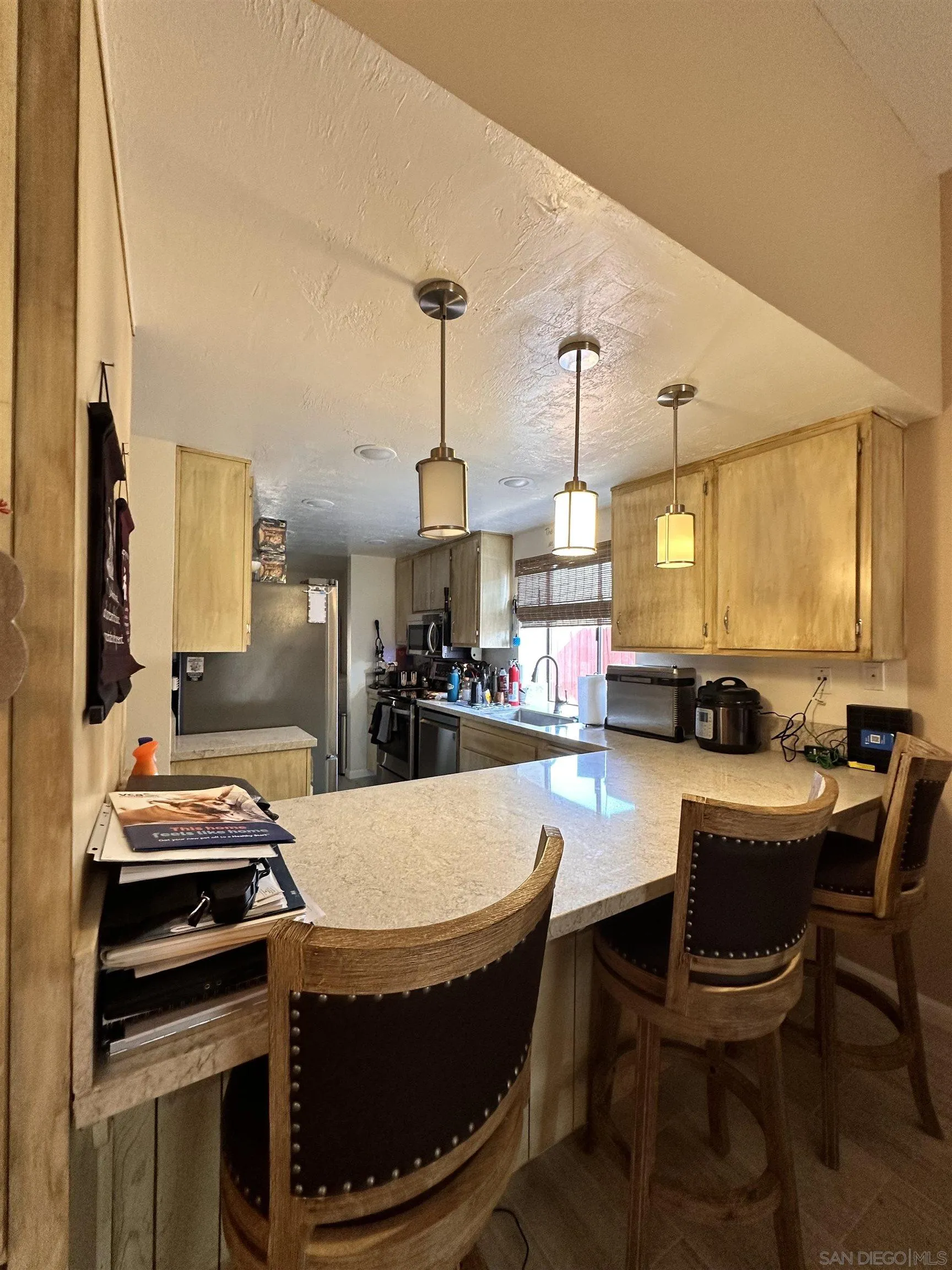 9627 Ramsgate Way Santee, CA 92071 - Photo 7 of 21 a dining room with chairs and window