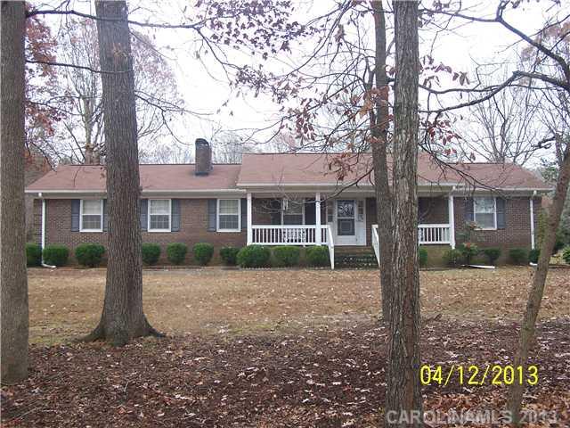 2119 Lathan Road Monroe, NC 28112 - Photo 1 of 16 a front view of a house with a yard