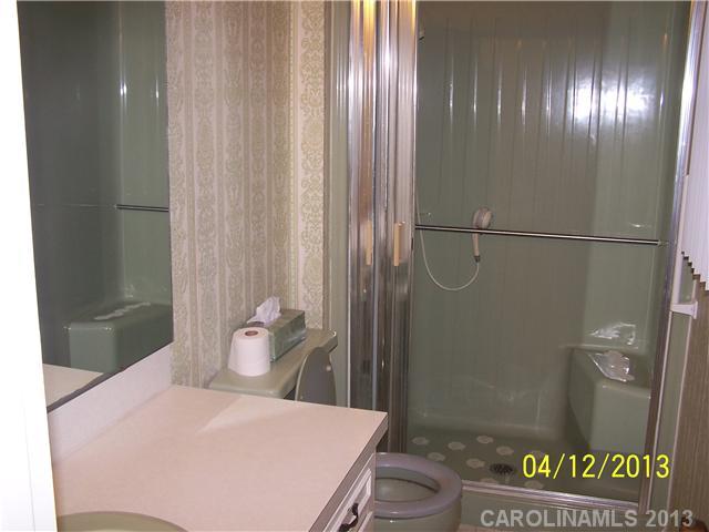 2119 Lathan Road Monroe, NC 28112 - Photo 11 of 16 a bathroom with a bathtub and shower