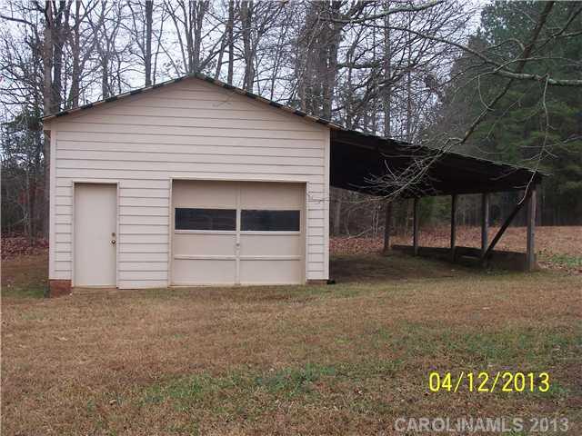2119 Lathan Road Monroe, NC 28112 - Photo 13 of 16 a front view of a house with a yard