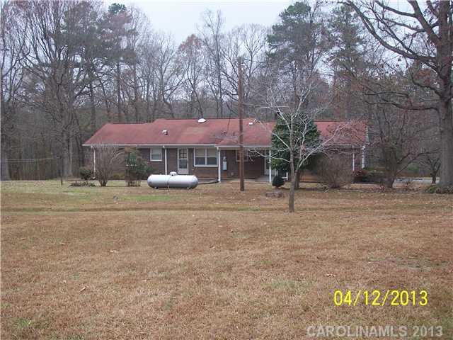 2119 Lathan Road Monroe, NC 28112 - Photo 15 of 16 a front view of a house with a yard