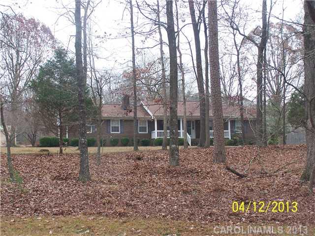 2119 Lathan Road Monroe, NC 28112 - Photo 16 of 16 a view of a house with a yard and trees