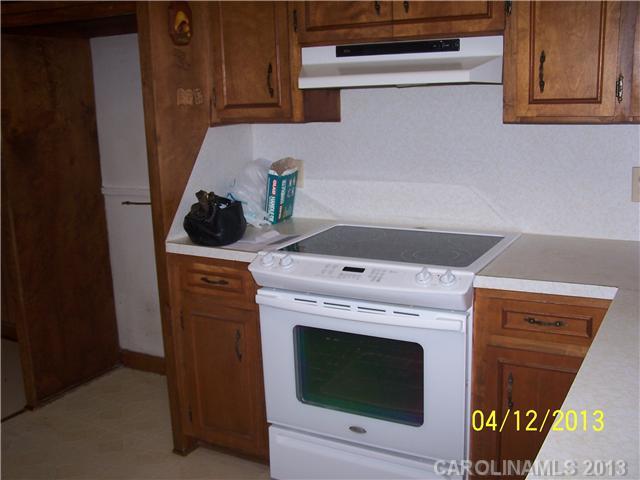 2119 Lathan Road Monroe, NC 28112 - Photo 5 of 16 a stove top oven sitting inside of a kitchen