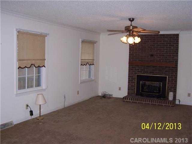 2119 Lathan Road Monroe, NC 28112 - Photo 7 of 16 a view of a livingroom with a fireplace