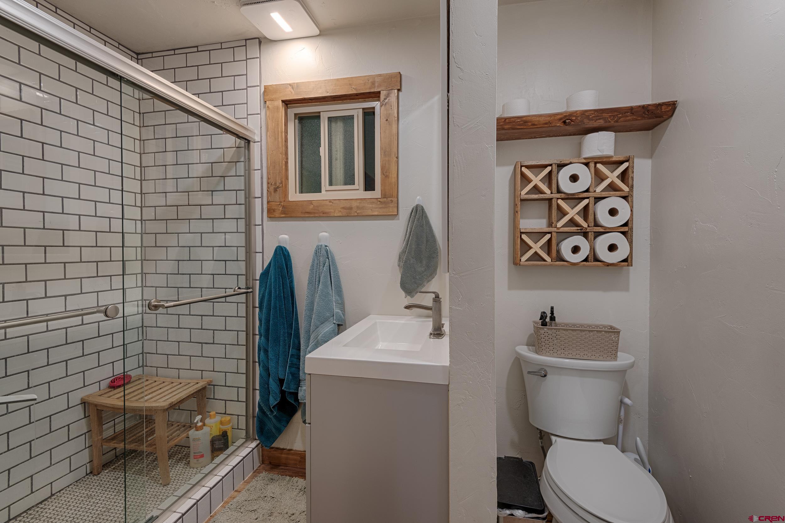 559 Suzanne Lane Ridgway, CO 81432 - Photo 19 of 45 a bathroom with a toilet and a sink