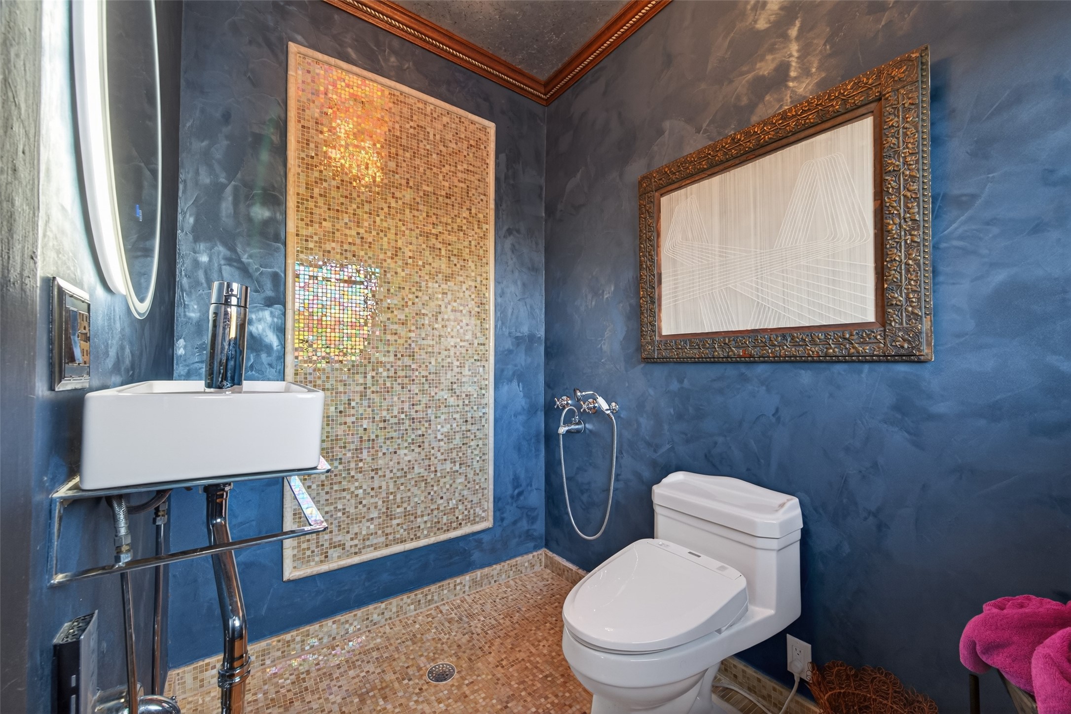 301 West Clay Street Houston, TX 77019 - Photo 14 of 24 Artfully designed bath featuring rich Venetian plaster walls, iridescent mosaic tile, and sleek modern fixtures. A striking space that blends bold texture with refined elegance.