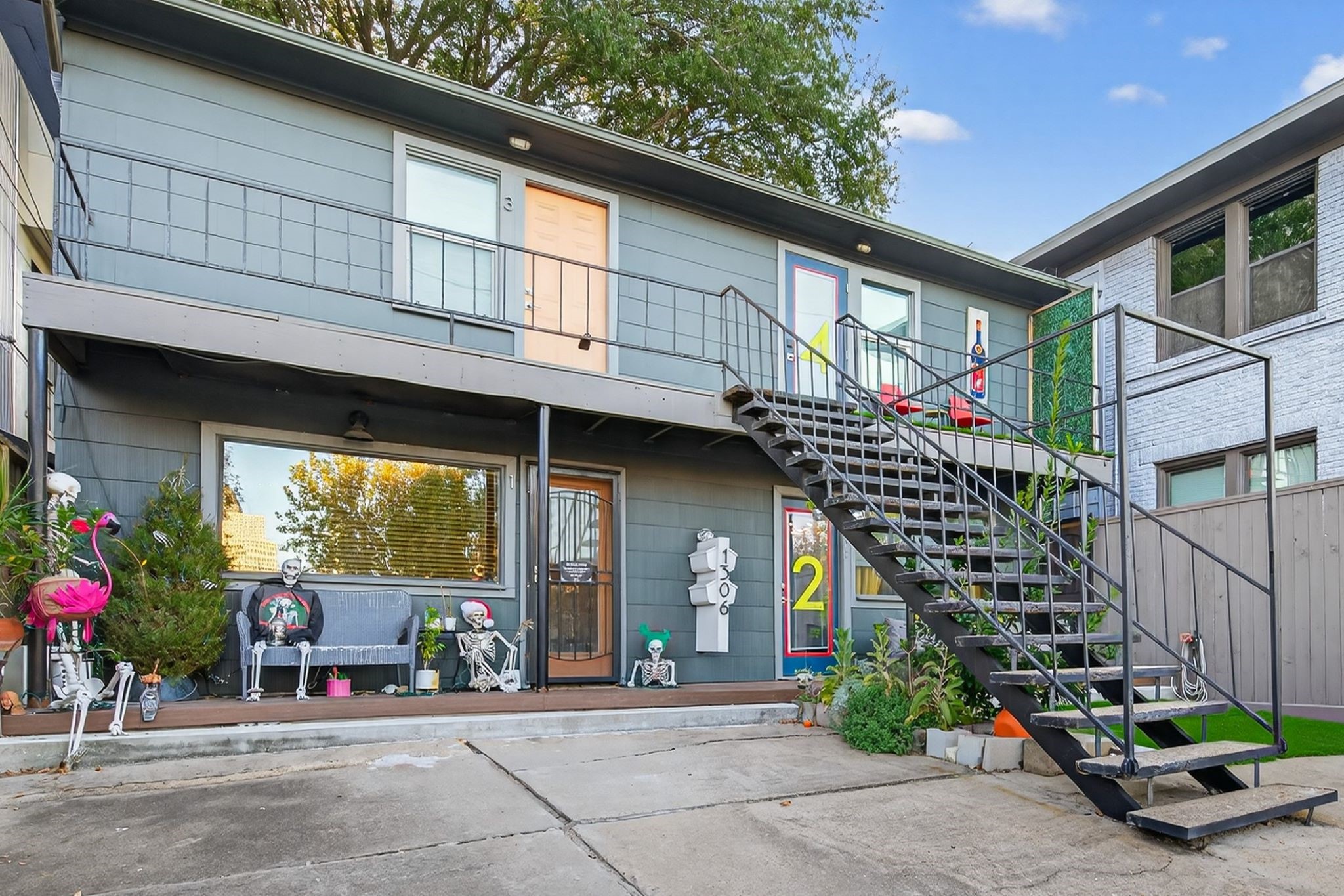 301 West Clay Street Houston, TX 77019 - Photo 17 of 24 The included property next door features four income-producing garage apartments, ideal for short- or long-term rentals.