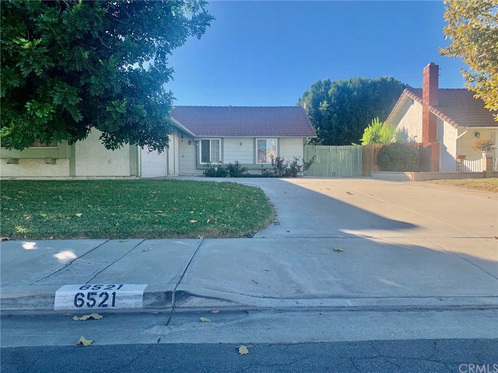 6521 Farmington Drive Riverside, CA 92504 - Photo 1 of 1 a front view of a house with garden