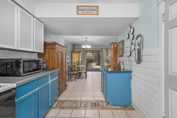 a kitchen with stainless steel appliances granite countertop a stove and cabinets