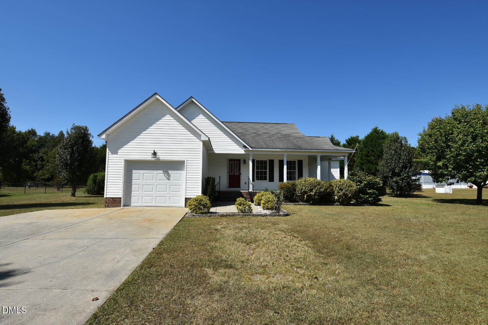 879 O B J Road Dunn, NC 28334 - Photo 2 of 23 a view of a house with backyard porch and sitting area