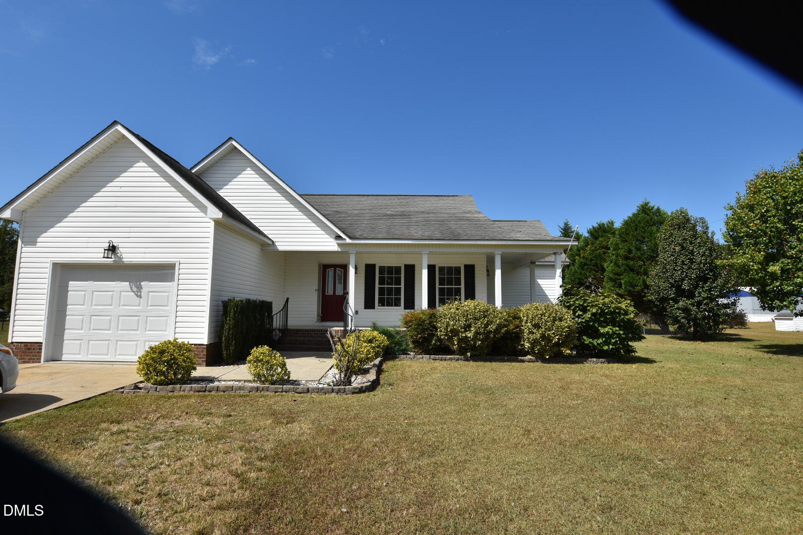879 O B J Road Dunn, NC 28334 - Photo 22 of 23 a front view of a house with yard and green space