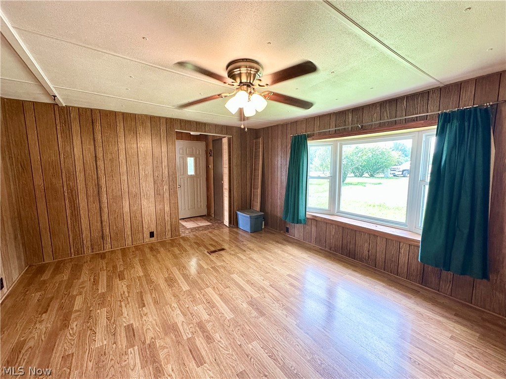28 Richter Road Colliers, WV 26035 - Photo 18 of 38 Family room featuring ceiling fan and hardwood floors