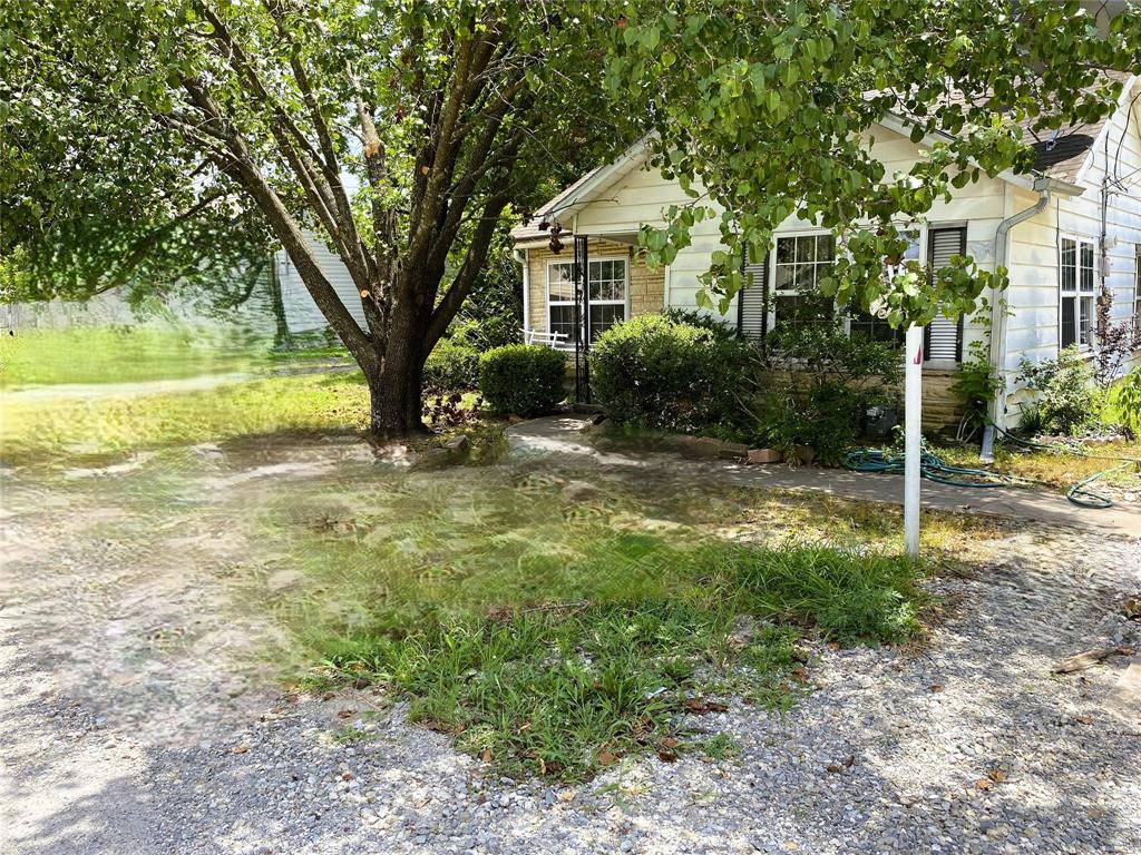 811 West 12th Street, Unit 815 Bonham, TX 75418 - Photo 1 of 23 a view of a house with backyard and a tree