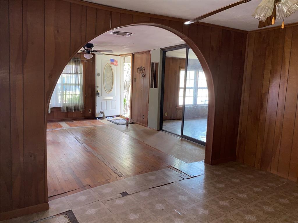 811 West 12th Street, Unit 815 Bonham, TX 75418 - Photo 14 of 23 an empty room with wooden floor and windows