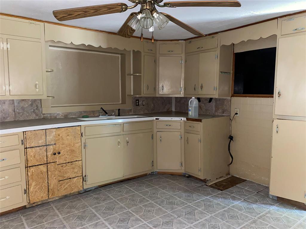811 West 12th Street, Unit 815 Bonham, TX 75418 - Photo 22 of 23 a utility room with cabinets